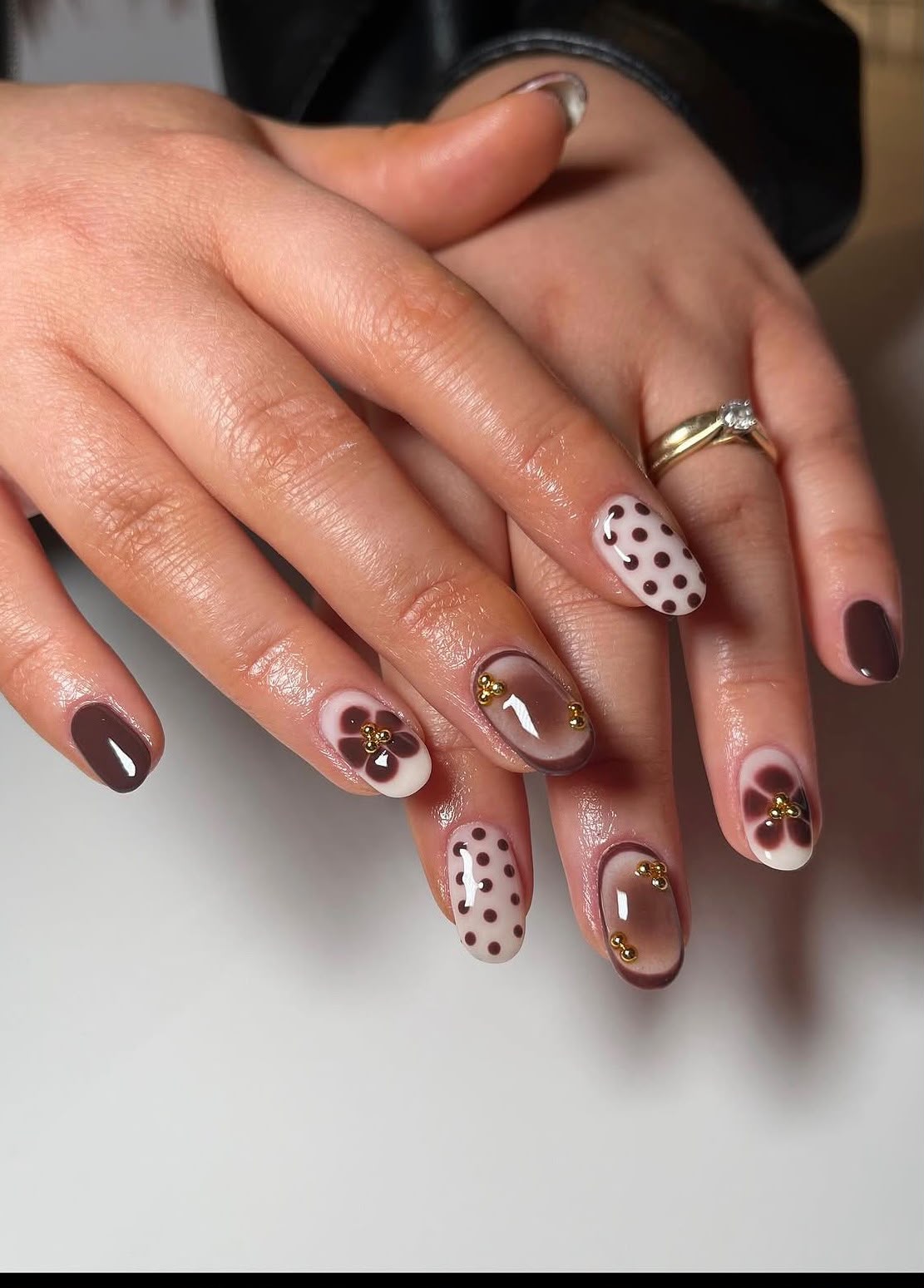 Brown floral manicure created at Rushden Nails